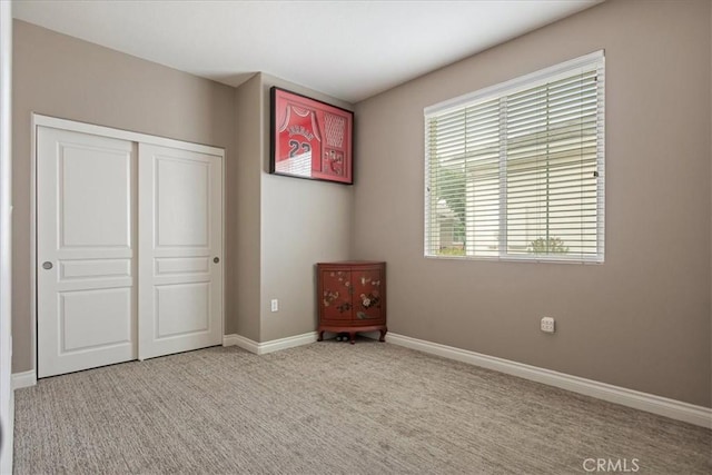 1682 Beaver Unit B, Beaumont, CA 92223 - unfurnished bedroom featuring a closet, carpet floors, and baseboards