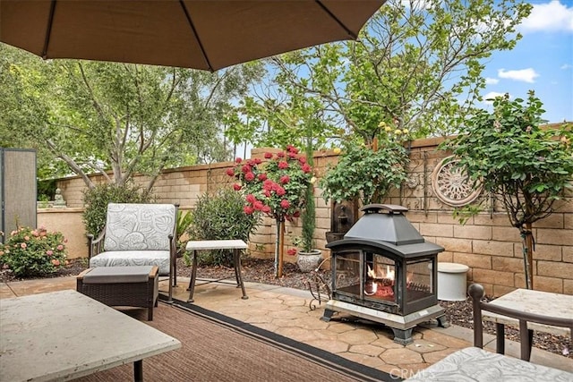 deck with a fenced backyard and a patio area