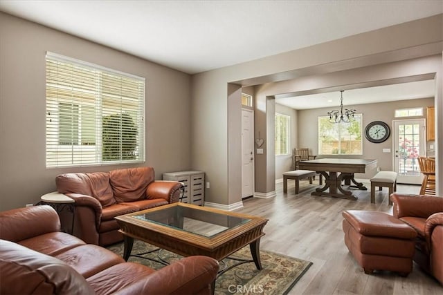 1682 Beaver Unit B, Beaumont, CA 92223 - living area with light wood-style flooring, a chandelier, and baseboards