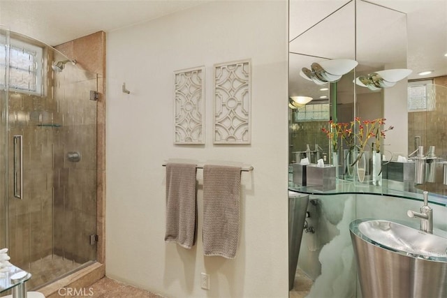 bathroom with a shower stall