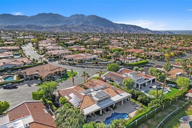aerial view of residential area with mountains