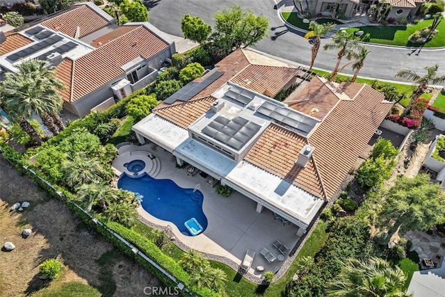 aerial view of property and surrounding area with a pool