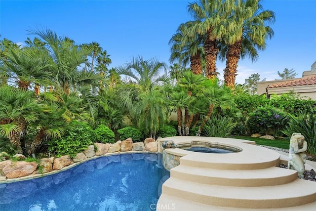 outdoor pool with an in-ground hot tub