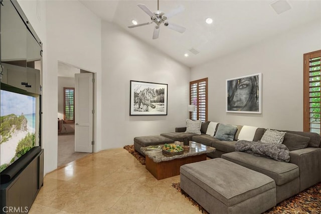 living area with ceiling fan, recessed lighting, and high vaulted ceiling