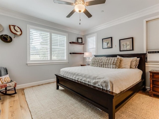 8670 Erika Ct, Atascadero, CA 93422 - bedroom with multiple windows, crown molding, wood finished floors, baseboards, and a ceiling fan