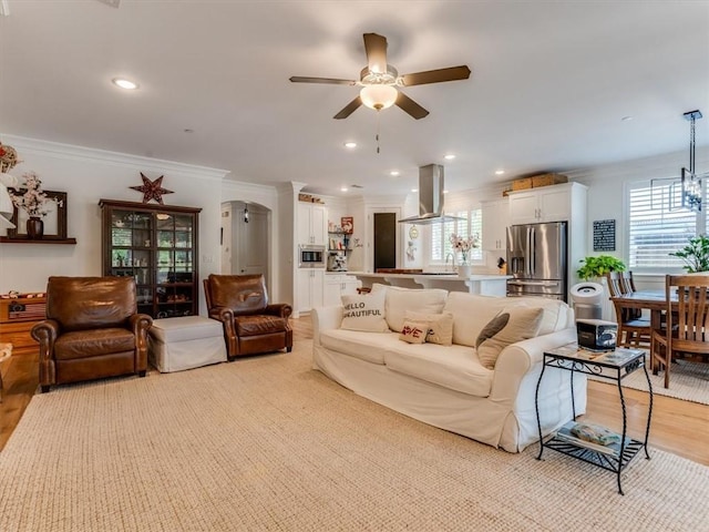 8670 Erika Ct, Atascadero, CA 93422 - living room featuring crown molding, a ceiling fan, light wood finished floors, and recessed lighting