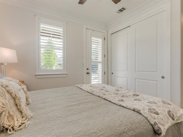 8670 Erika Ct, Atascadero, CA 93422 - bedroom with crown molding, a closet, and ceiling fan
