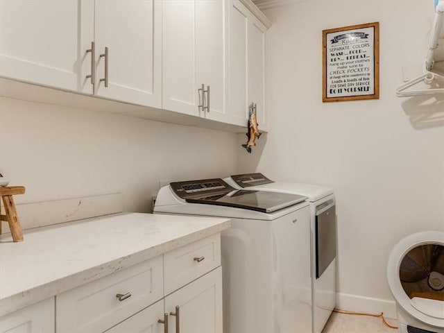 8670 Erika Ct, Atascadero, CA 93422 - laundry room featuring washing machine and dryer, cabinet space, and baseboards