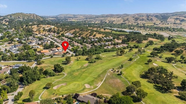 8670 Erika Ct, Atascadero, CA 93422 - aerial overview of property's location with a mountain backdrop, a golf club, and nearby suburban area
