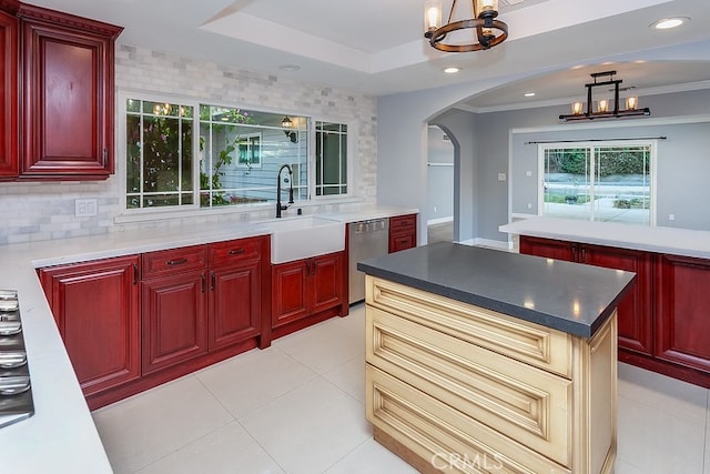 kitchen with dishwasher, a chandelier, dark brown cabinets, arched walkways, and recessed lighting