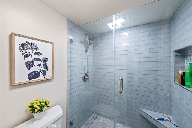 full bath with a shower stall and toilet
