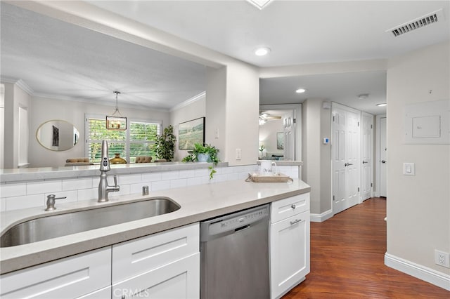 kitchen featuring dishwasher, a sink, white cabinetry, crown molding, and baseboards