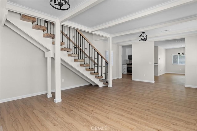 9019 San Gabriel Rd, Atascadero, CA 93422 - staircase featuring a chandelier, wood finished floors, baseboards, and beamed ceiling