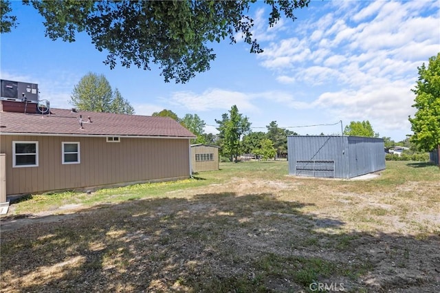 9019 San Gabriel Rd, Atascadero, CA 93422 - view of yard with central air condition unit and an outbuilding