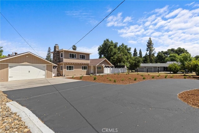 9019 San Gabriel Rd, Atascadero, CA 93422 - traditional home with a detached garage, a chimney, and an outbuilding