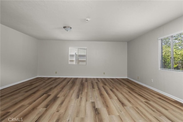 9019 San Gabriel Rd, Atascadero, CA 93422 - spare room featuring light wood finished floors, baseboards, and a smoke detector