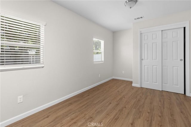 9019 San Gabriel Rd, Atascadero, CA 93422 - unfurnished bedroom with wood finished floors, baseboards, and a closet
