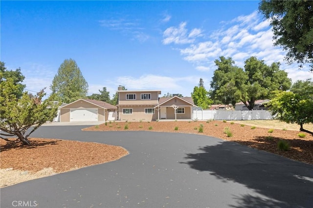 9019 San Gabriel Rd, Atascadero, CA 93422 - view of front of house with fence, a garage, and an outbuilding