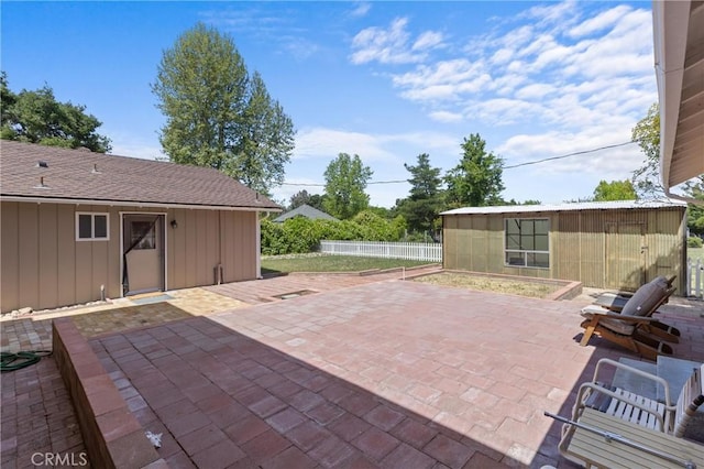9019 San Gabriel Rd, Atascadero, CA 93422 - view of patio featuring fence and an outbuilding
