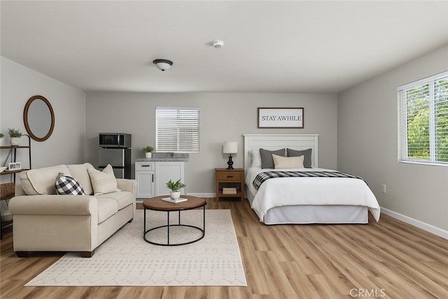 9019 San Gabriel Rd, Atascadero, CA 93422 - bedroom featuring light wood-style flooring and baseboards