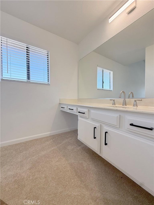 bathroom featuring vanity and baseboards