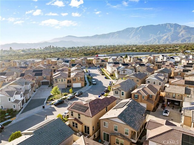 aerial perspective of suburban area with a mountainous background