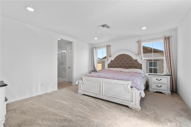 bedroom featuring light colored carpet and recessed lighting