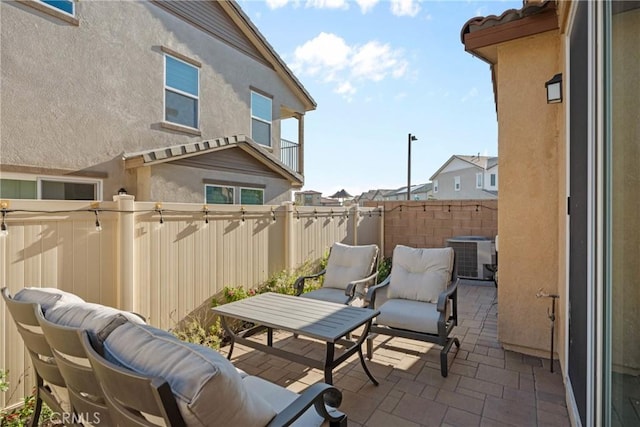 balcony with a patio area and cooling unit