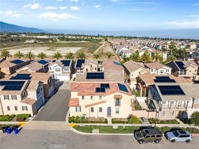 aerial view of residential area featuring mountains