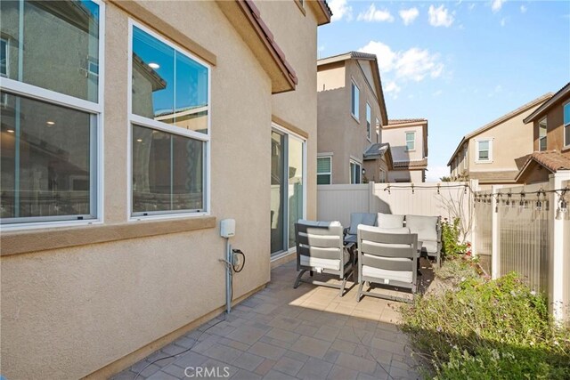 view of patio / terrace featuring fence and outdoor dining area