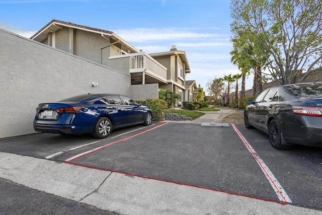 17438 Ashburton Rd, Rancho Bernardo San Diego, CA 92128 - uncovered parking lot featuring a residential view