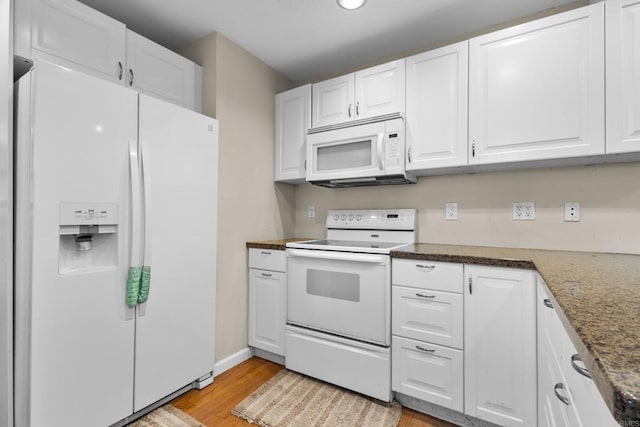 17438 Ashburton Rd, Rancho Bernardo San Diego, CA 92128 - kitchen featuring white appliances, white cabinetry, light wood-style floors, dark stone counters, and recessed lighting