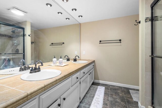 17438 Ashburton Rd, Rancho Bernardo San Diego, CA 92128 - full bathroom featuring double vanity, a stall shower, and recessed lighting