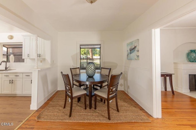 dining space featuring light wood-style flooring