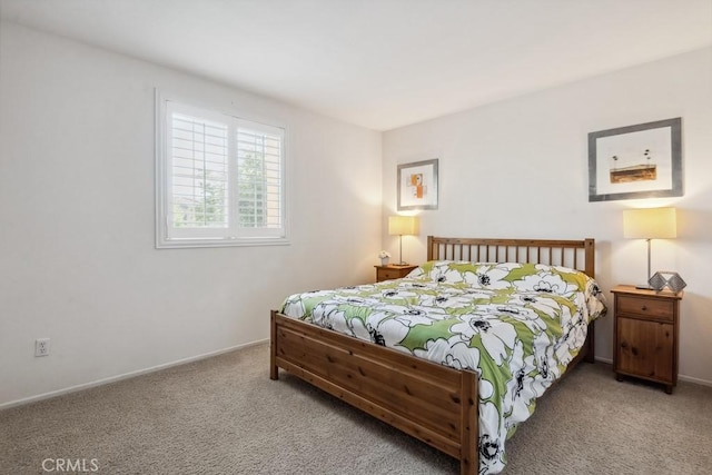 carpeted bedroom with baseboards