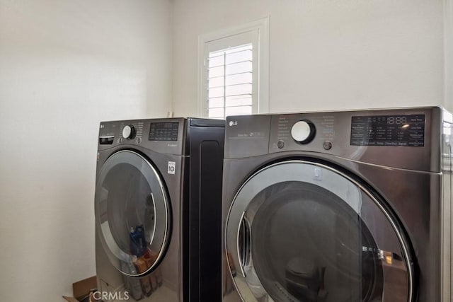 laundry room with independent washer and dryer