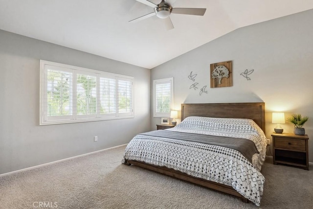 carpeted bedroom with lofted ceiling, baseboards, and ceiling fan
