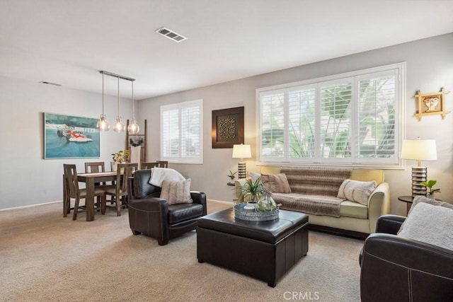 living room with light colored carpet and baseboards