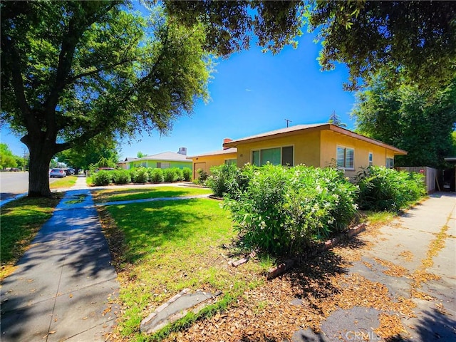3733 N Fresno St, Fresno, CA 93726 - view of front of property featuring a front lawn and stucco siding