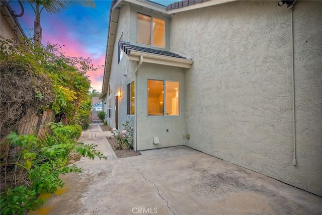 5166 Via Portola, Oceanside, CA 92057 - rear view of property with stucco siding, fence, and a patio area
