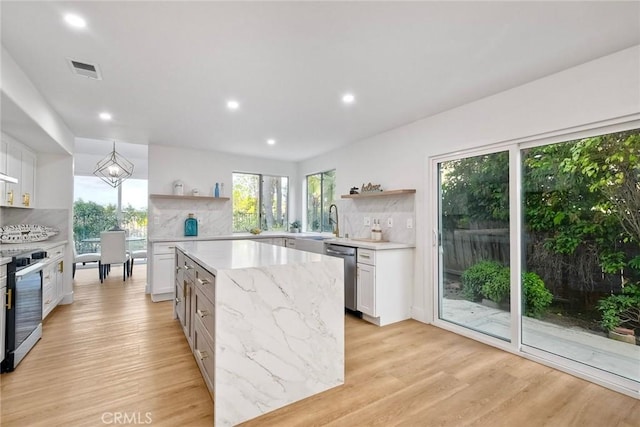5166 Via Portola, Oceanside, CA 92057 - kitchen with open shelves, stainless steel appliances, light wood-type flooring, and recessed lighting