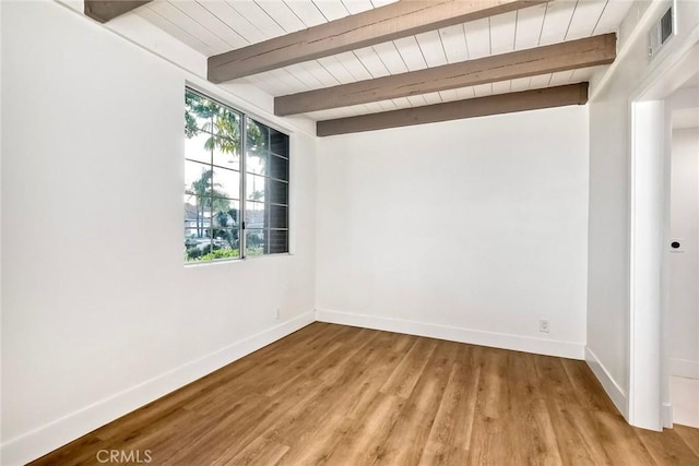 5166 Via Portola, Oceanside, CA 92057 - unfurnished room with baseboards, beamed ceiling, wood finished floors, and wood ceiling