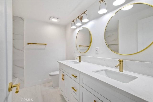 5166 Via Portola, Oceanside, CA 92057 - full bathroom featuring toilet, marble finish flooring, and double vanity