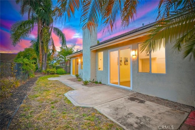 5166 Via Portola, Oceanside, CA 92057 - yard at dusk with fence and a patio