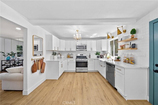 22384 Crest Forest Dr, Cedarpines Park, CA 92322 - kitchen featuring stainless steel appliances, plenty of natural light, light wood finished floors, a sink, and recessed lighting