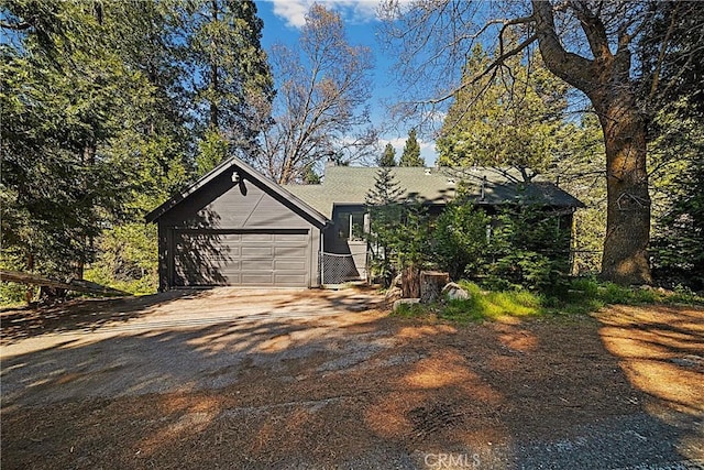 22384 Crest Forest Dr, Cedarpines Park, CA 92322 - view of front of house featuring driveway and a garage