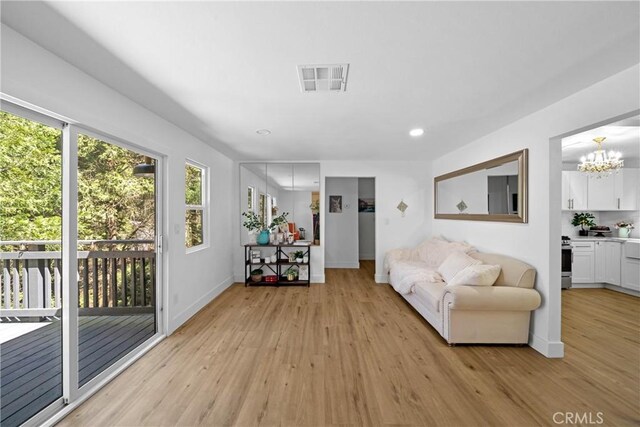22384 Crest Forest Dr, Cedarpines Park, CA 92322 - living area featuring light wood-style flooring, a chandelier, baseboards, and recessed lighting