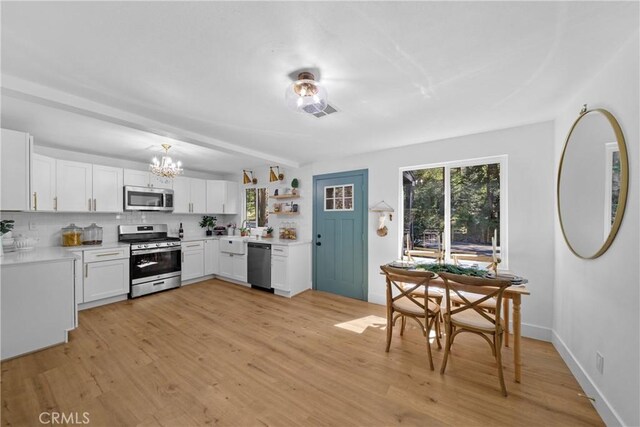 22384 Crest Forest Dr, Cedarpines Park, CA 92322 - kitchen featuring appliances with stainless steel finishes, plenty of natural light, and light countertops