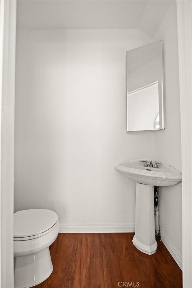 335 Montechico Dr, Monterey Park, CA 91754 - bathroom with wood finished floors, baseboards, and toilet