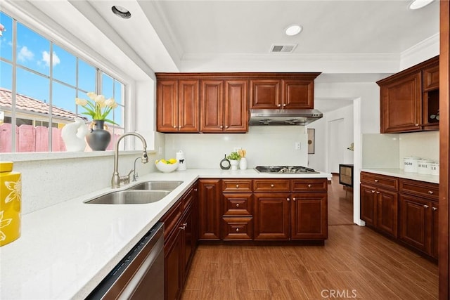 335 Montechico Dr, Monterey Park, CA 91754 - kitchen featuring a sink, under cabinet range hood, appliances with stainless steel finishes, light countertops, and crown molding